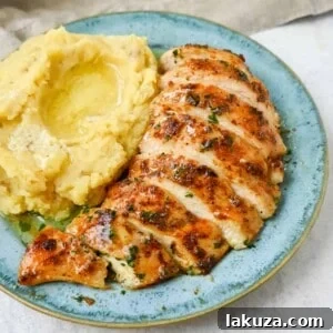 This is the easiest baked chicken recipe that is so flavorful and juicy. This homemade spice rub is perfect for oven baked chicken and makes it perfectly spiced. I am sharing my tips for making the best baked chicken.