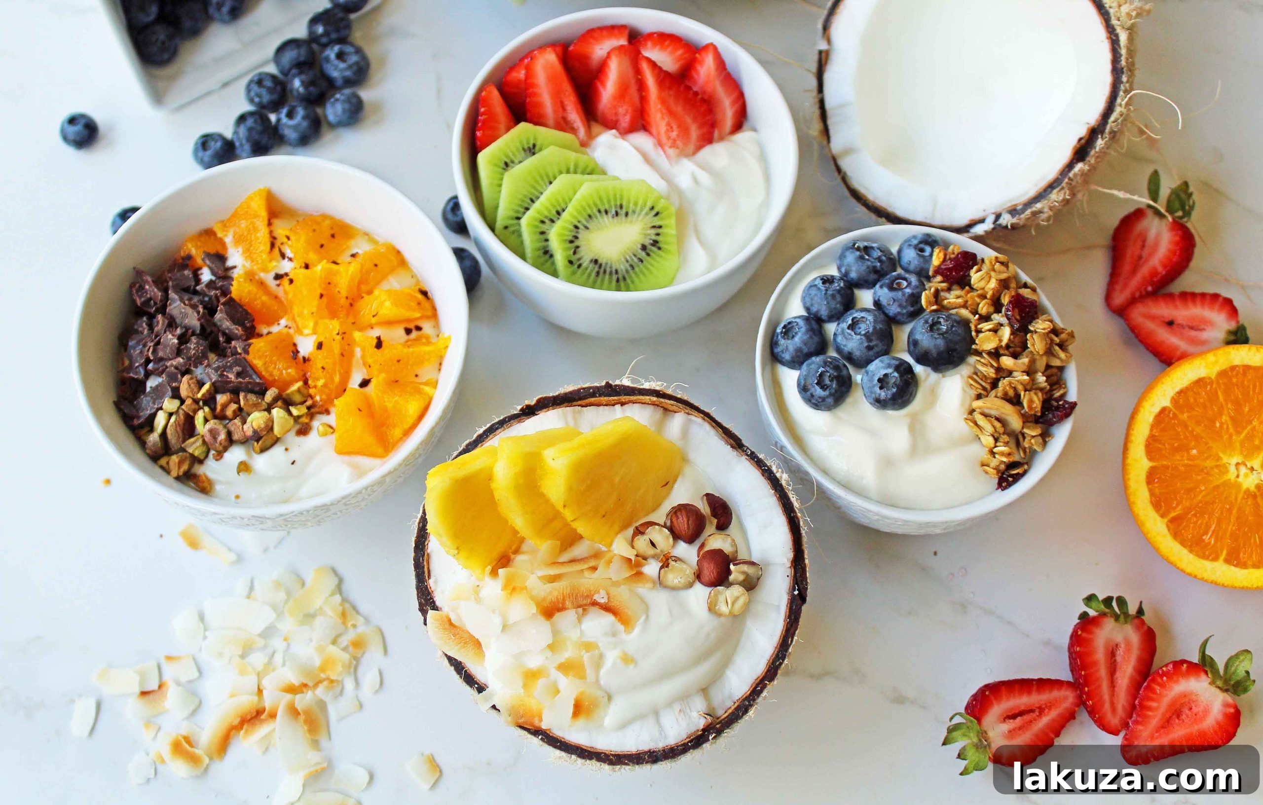 Greek Yogurt Breakfast Bowls with Toppings by Modern Honey. Healthy Greek Yogurt topped with fresh fruits, nuts, and honey. It's a perfect breakfast to start the day!