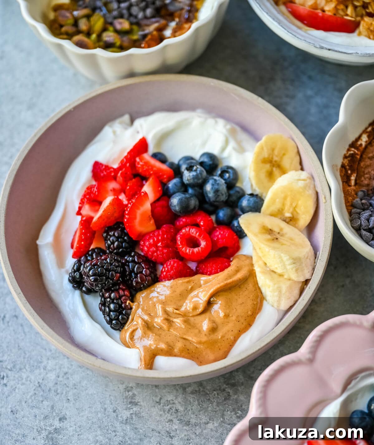 Peanut Butter Berry Yogurt Bowl. Greek yogurt, natural peanut butter, strawberries, raspberries, blackberries, blueberries, bananas.