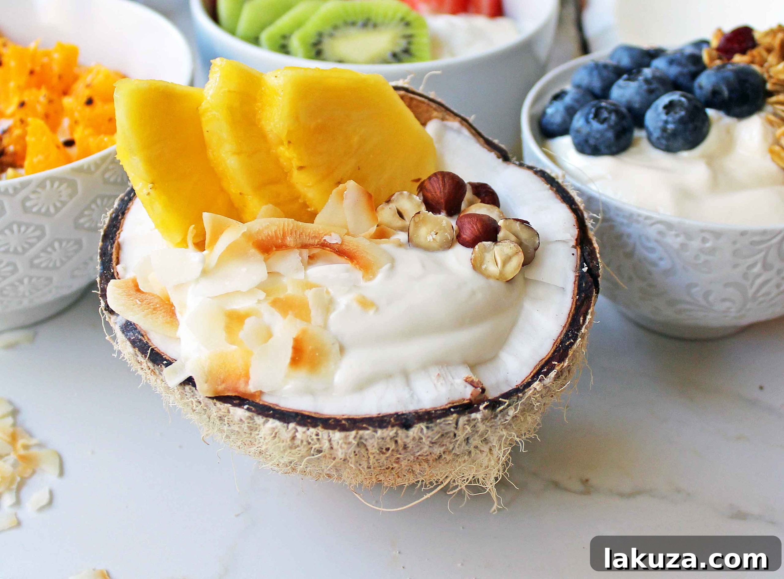 Greek Yogurt Breakfast Bowls with Toppings by Modern Honey. Healthy Greek Yogurt topped with fresh fruits, nuts, and honey. It's a perfect breakfast to start the day!