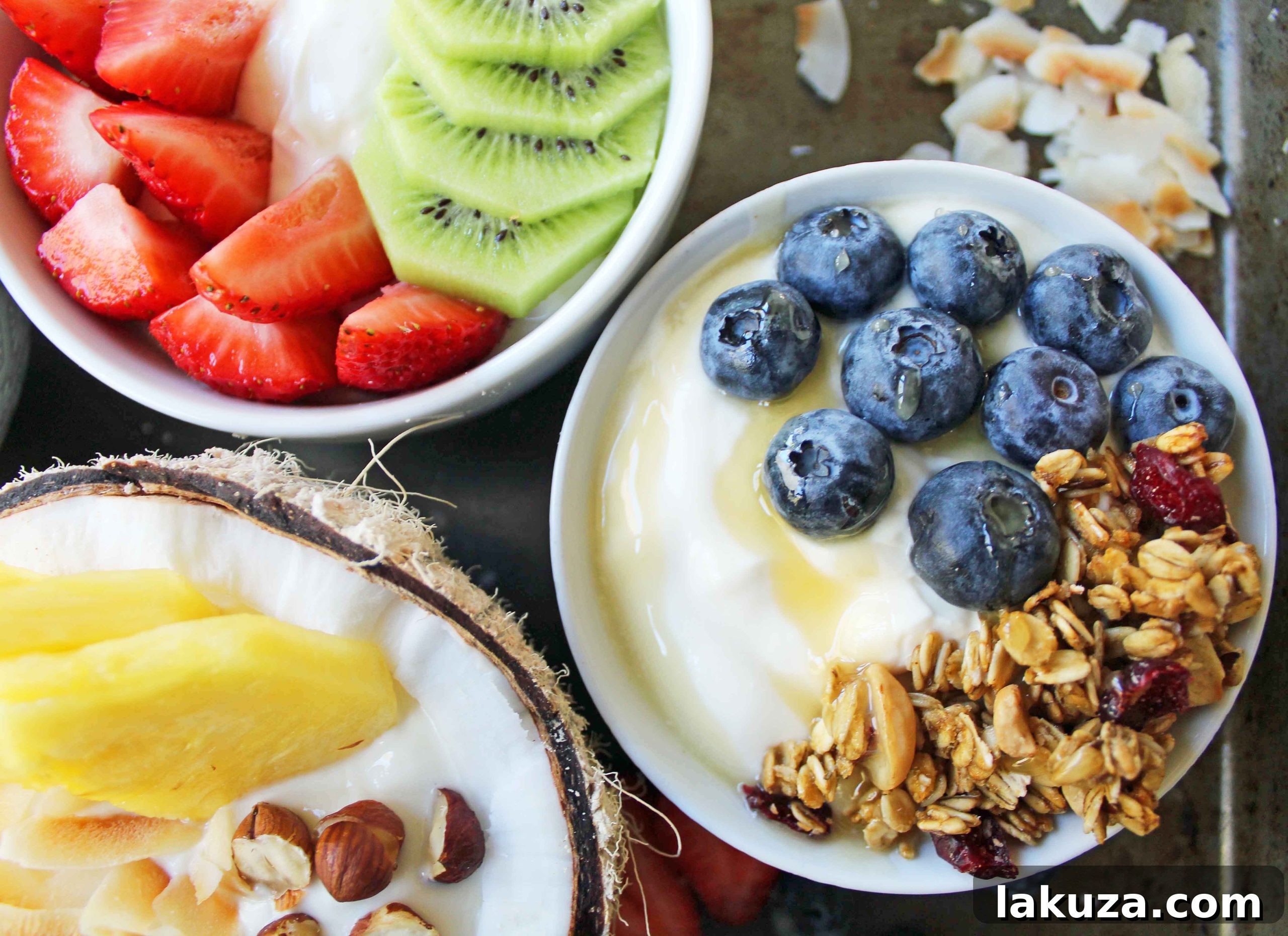 Greek Yogurt Breakfast Bowls with Toppings by Modern Honey. Healthy Greek Yogurt topped with fresh fruits, nuts, and honey. It's a perfect breakfast to start the day!