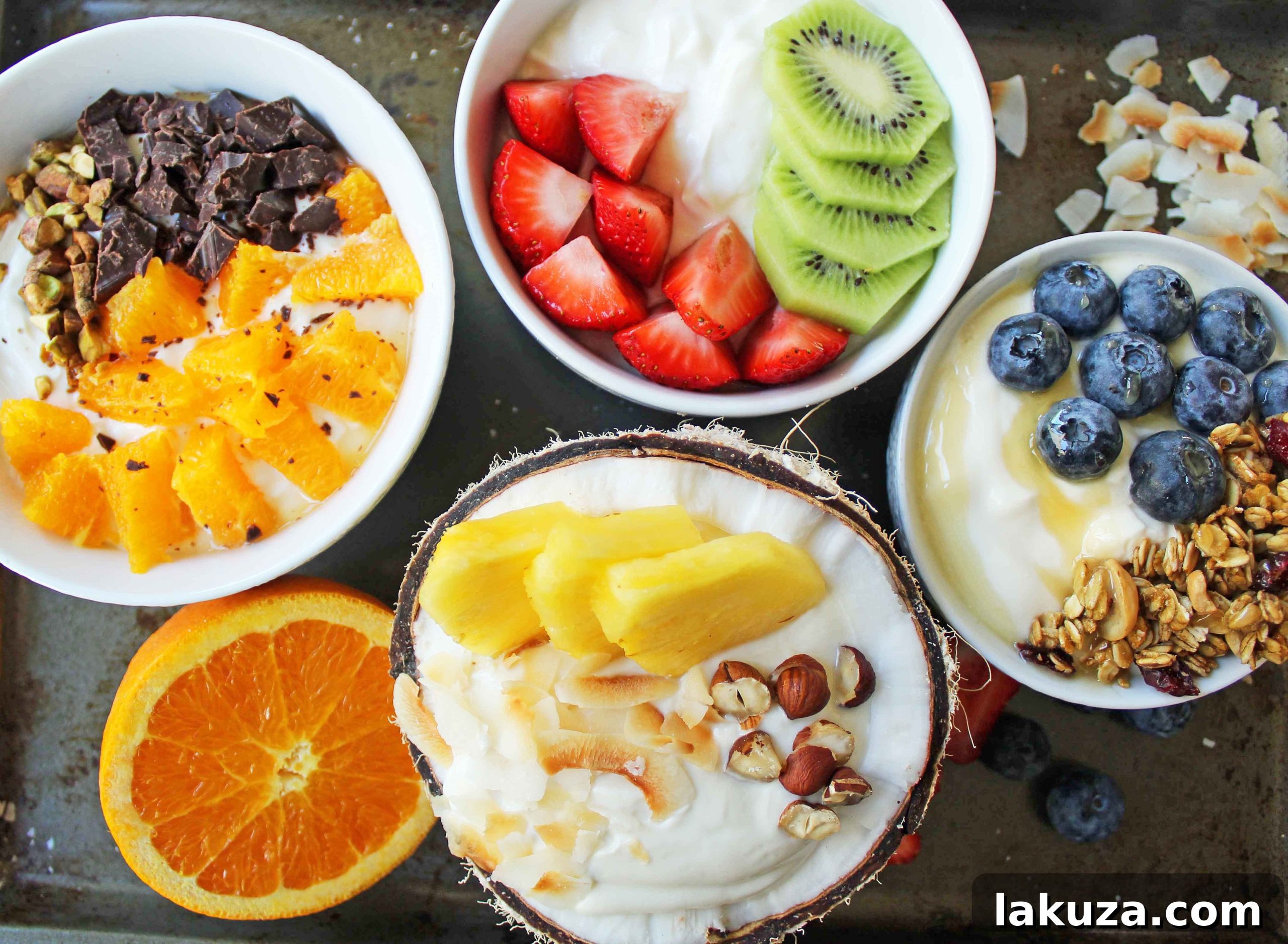 Greek Yogurt Breakfast Bowls with Toppings by Modern Honey. Healthy Greek Yogurt topped with fresh fruits, nuts, and honey. It's a perfect breakfast to start the day!