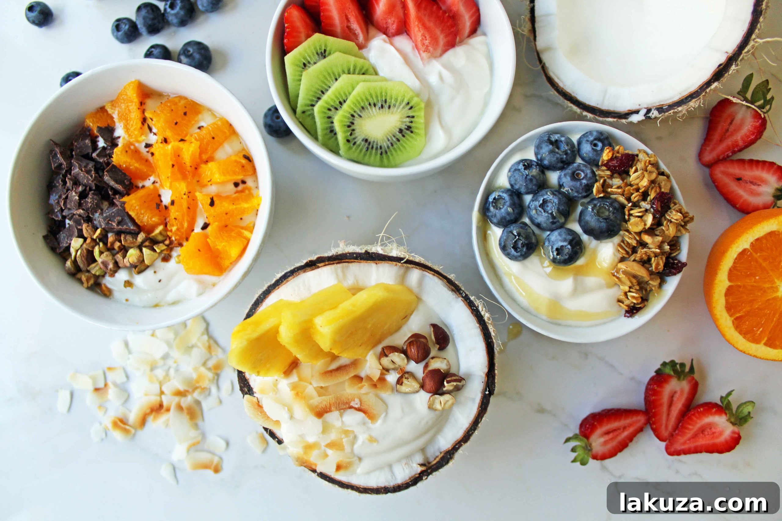 Greek Yogurt Breakfast Bowls with Toppings by Modern Honey. Healthy Greek Yogurt topped with fresh fruits, nuts, and honey. It's a perfect breakfast to start the day!
