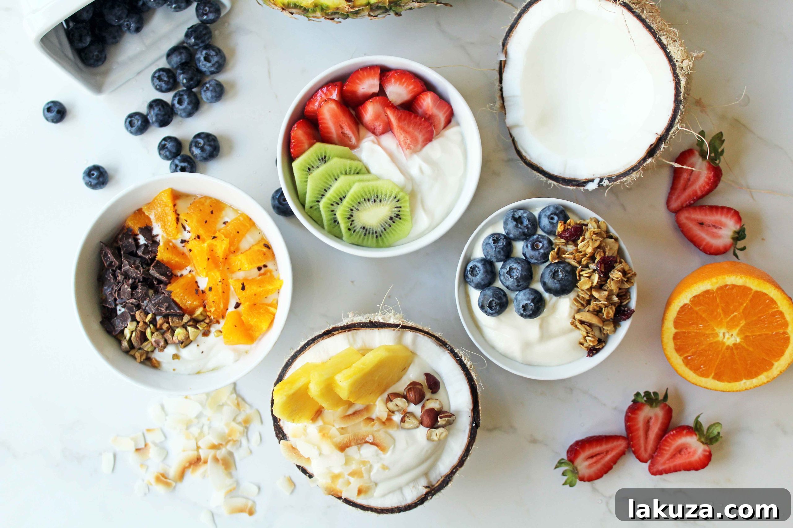 Greek Yogurt Breakfast Bowls with Toppings by Modern Honey. Healthy Greek Yogurt topped with fresh fruits, nuts, and honey. It's a perfect breakfast to start the day!