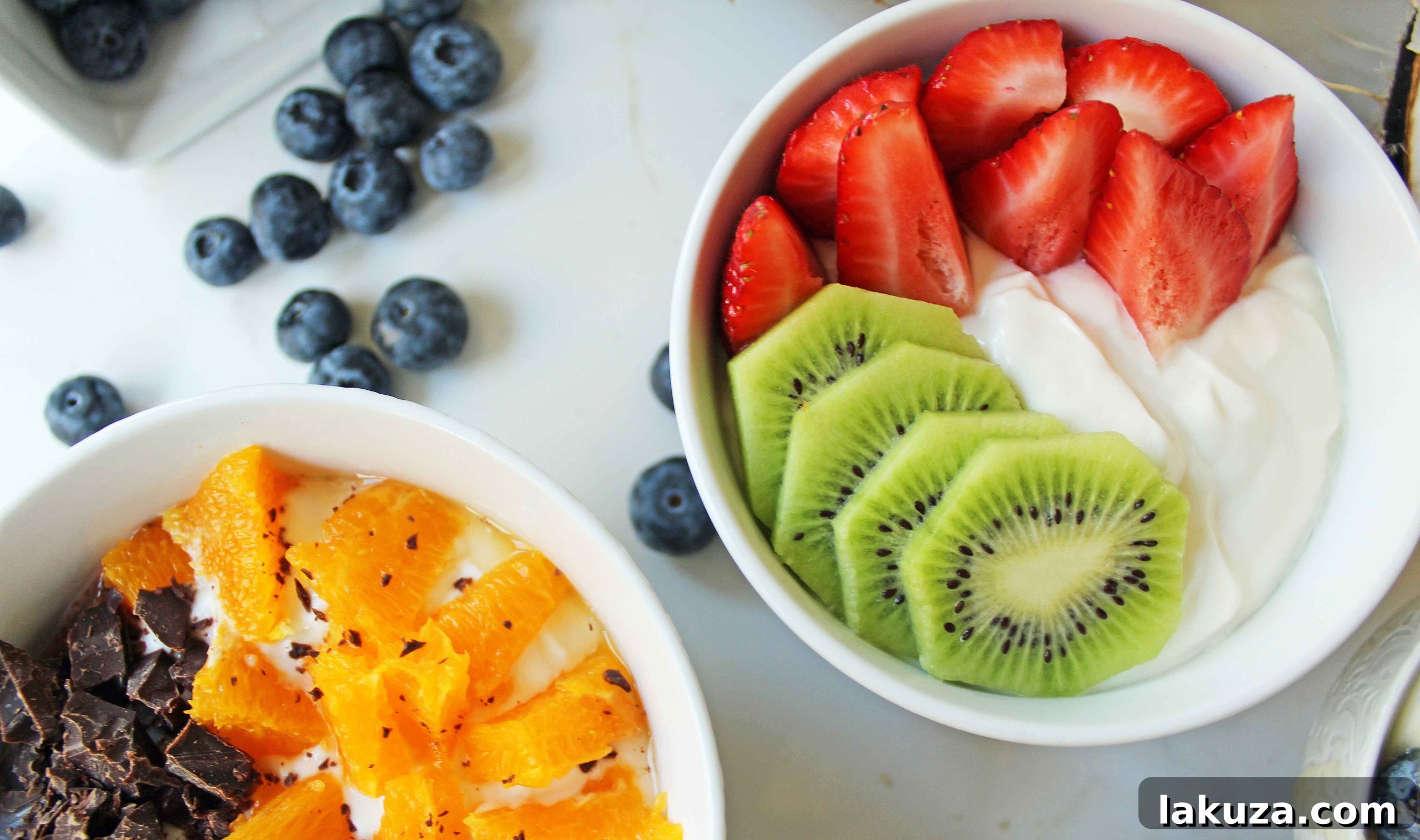 Greek Yogurt Breakfast Bowls with Toppings by Modern Honey. Healthy Greek Yogurt topped with fresh fruits, nuts, and honey. It's a perfect breakfast to start the day!