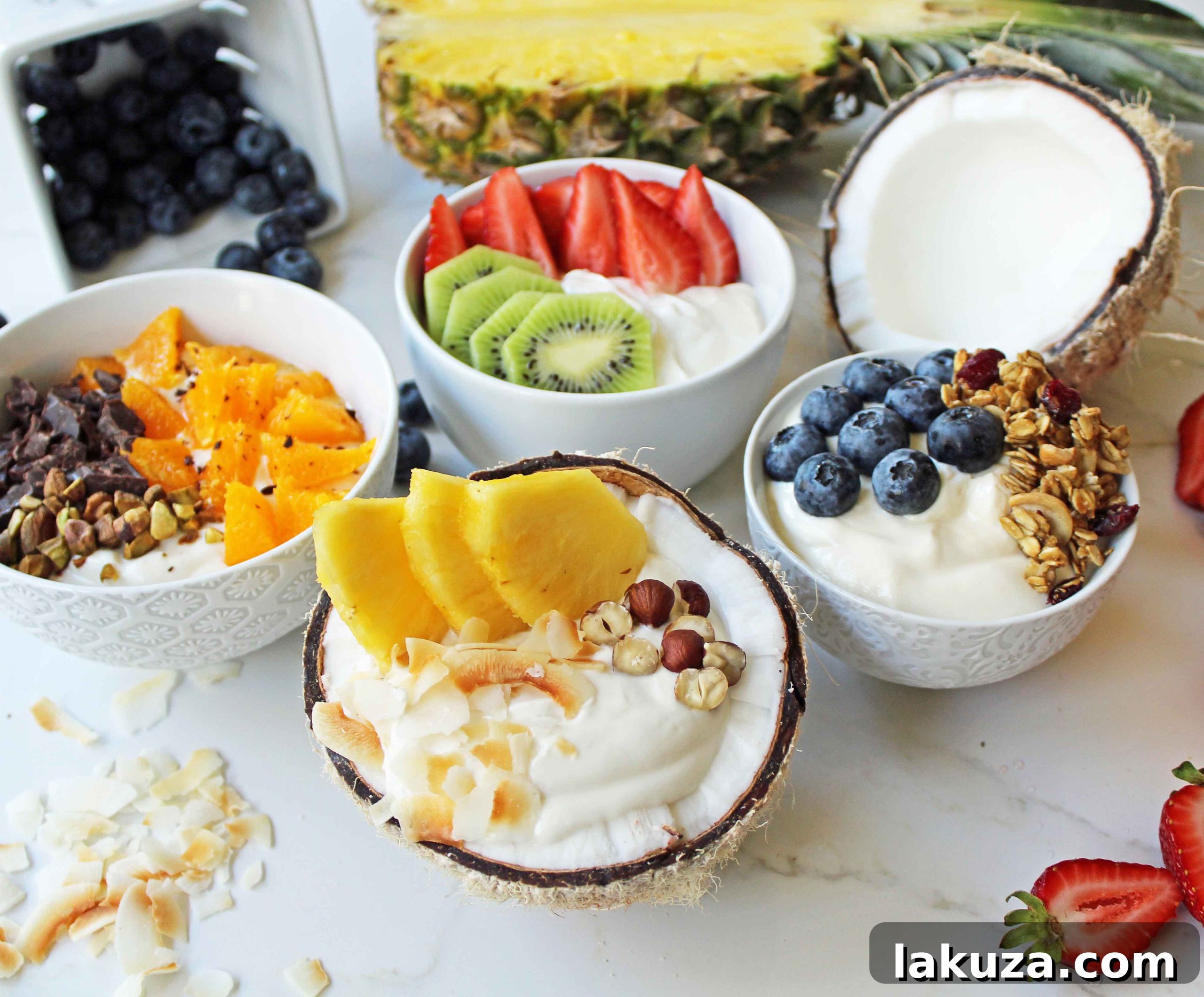 Greek Yogurt Breakfast Bowls with Toppings by Modern Honey. Healthy Greek Yogurt topped with fresh fruits, nuts, and honey. It's a perfect breakfast to start the day!