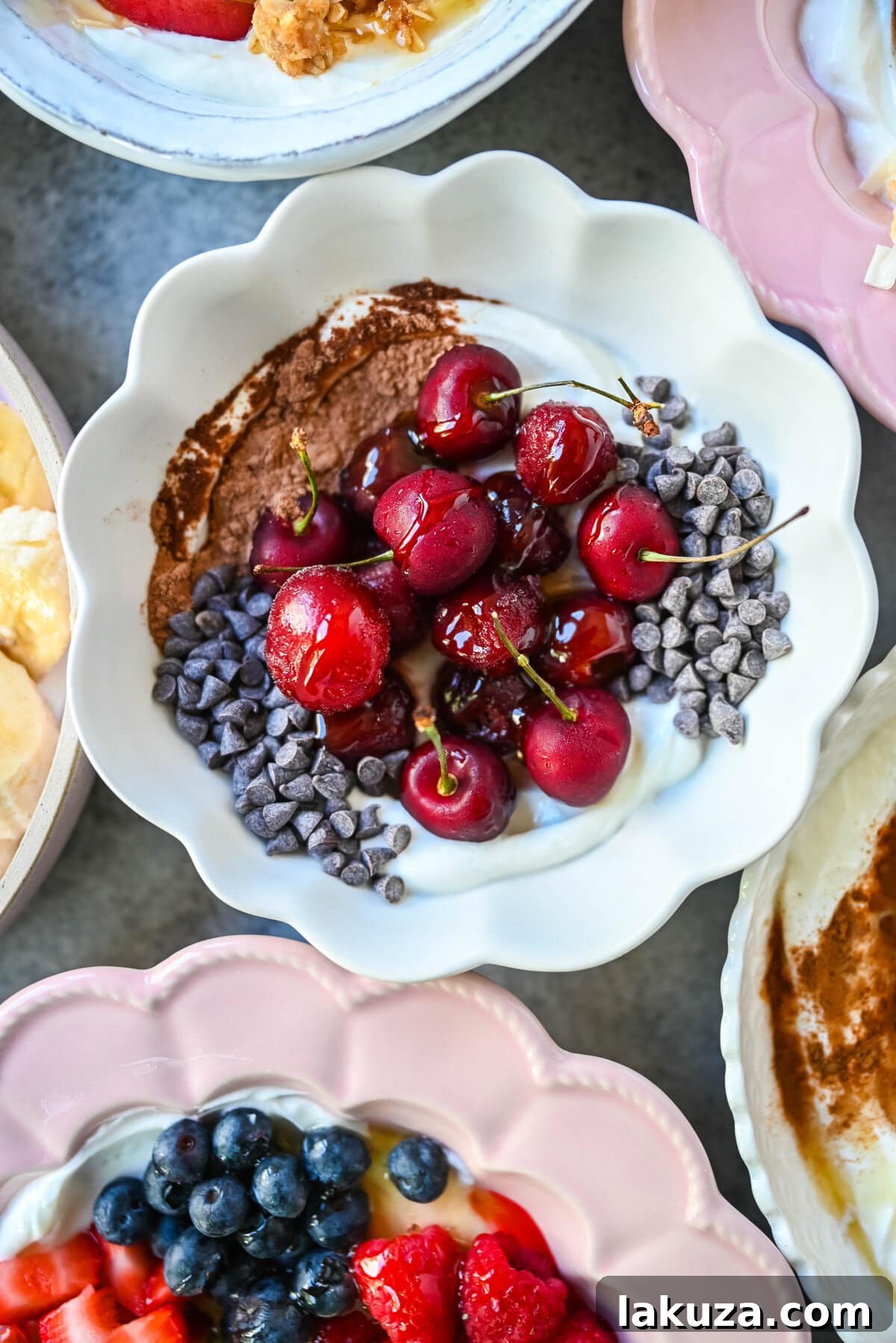 Chocolate Covered Cherry Greek Yogurt Breakfast Bowl. Greek yogurt, frozen cherries, cacao powder, mini semisweet chocolate chips.
