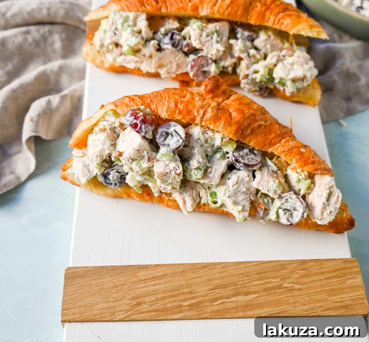 Ultimate Chicken Salad 2 Creamy Homemade Chicken Salad made with tender chicken, crunchy celery, green onion, sweet grapes, and crunchy almonds in a mayonnaise dressing. This is a classic chicken salad recipe that everyone loves and is perfect for a quick lunch or potluck.