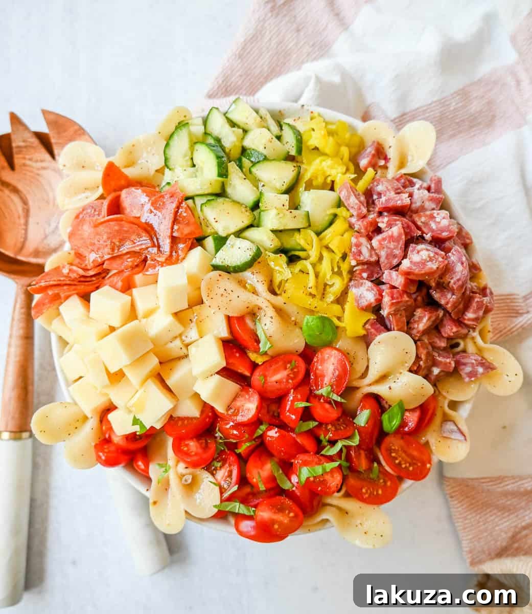 Zesty Italian Pasta Medley 4 The array of fresh ingredients laid out for the homemade creamy red wine vinaigrette dressing, including olive oil, red wine vinegar, oregano, chili flakes, salt, pepper, mayonnaise, and honey.