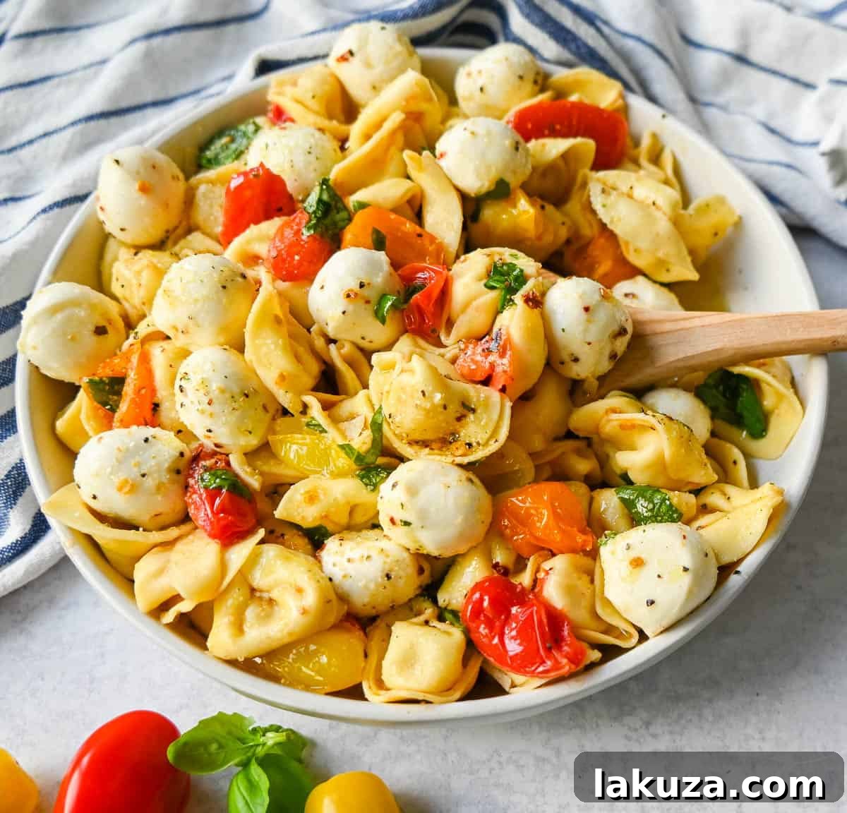 Sun-Kissed Caprese Tortellini 3 This Caprese Tortellini is made with cheese Tortellini tossed with sauteed garlic and tomatoes in extra virgin olive oil, fresh basil, and fresh mozzarella and spices. This fresh tortellini caprese pasta is perfect for summer!