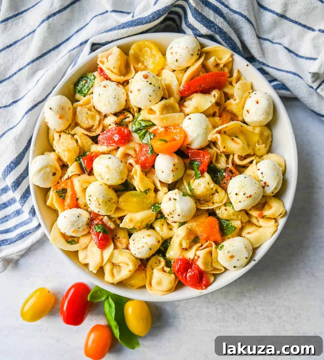Sun-Kissed Caprese Tortellini 4 This Caprese Tortellini is made with cheese Tortellini tossed with sauteed garlic and tomatoes in extra virgin olive oil, fresh basil, and fresh mozzarella and spices. This fresh tortellini caprese pasta is perfect for summer!