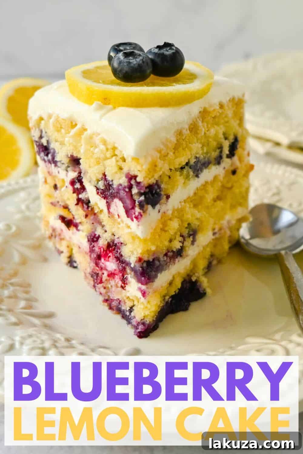 Beautifully decorated lemon blueberry cake with a golden hue and fresh fruit garnishes