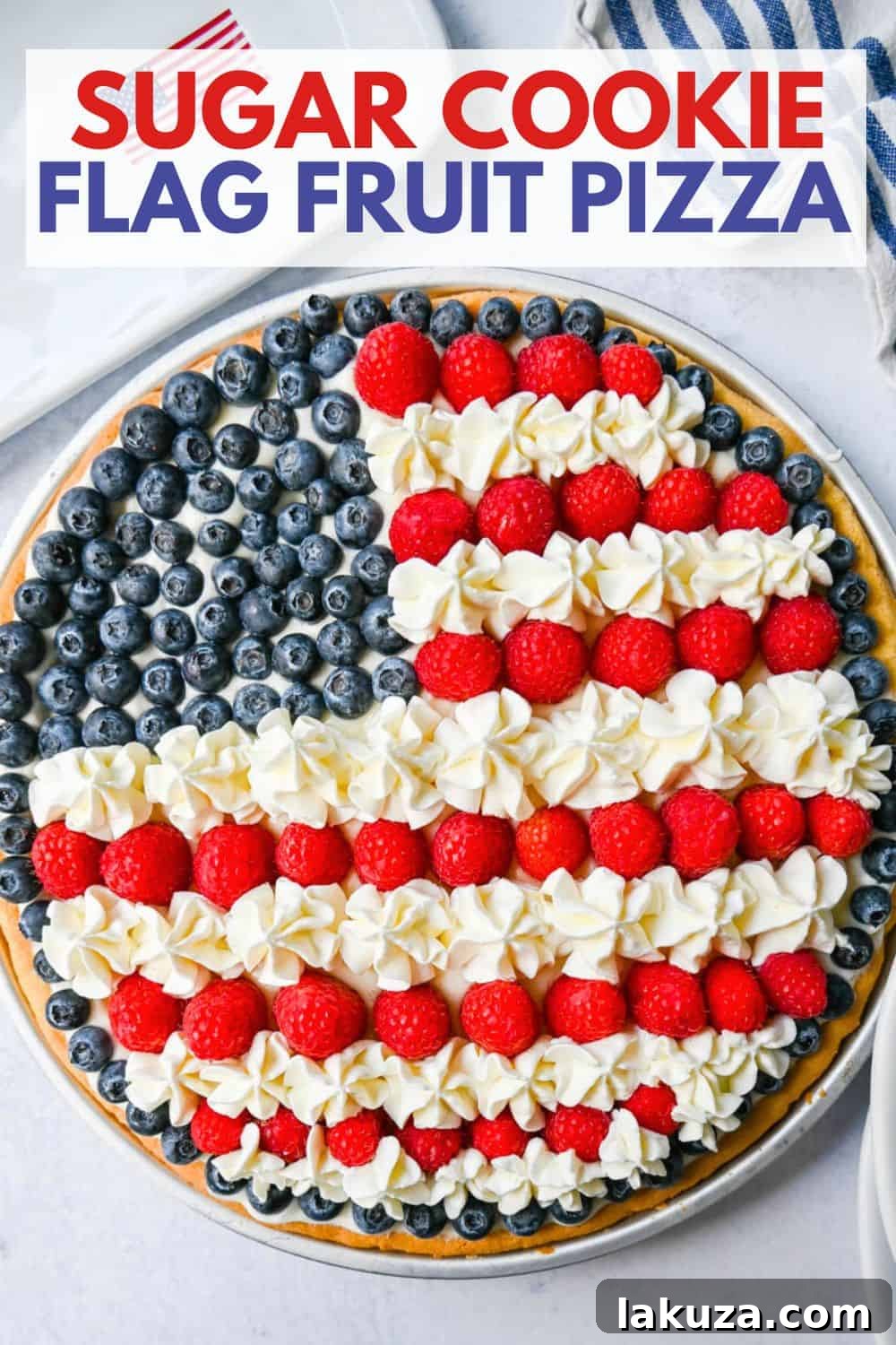 The ultimate Sugar Cookie Flag Fruit Pizza, an ideal patriotic dessert for the 4th of July, with a soft sugar cookie base, creamy frosting, and fresh berries.
