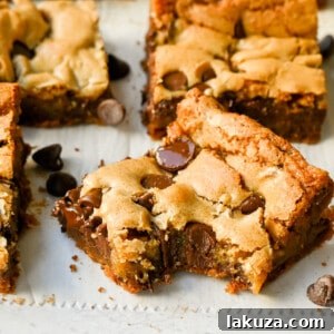 The Best Chocolate Chip Blondies Recipe Ever! How to make chewy, soft blondies from scratch. This is the most delicious and easiest chocolate chip blondie recipe.