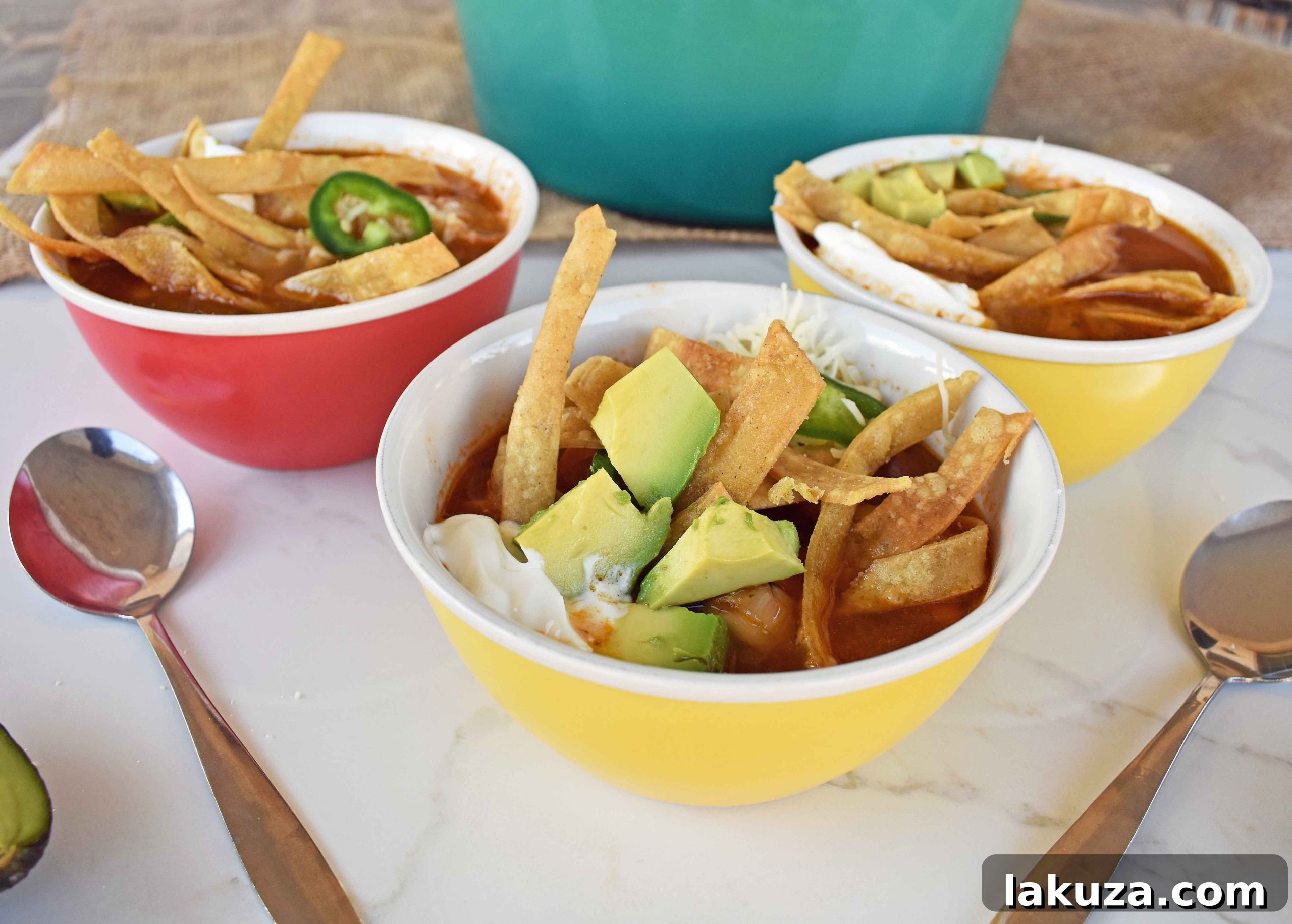 Hearty Chicken Tortilla Soup 5 A bowl of delectable Chicken Tortilla Soup from Modern Honey, garnished lavishly, highlighting the fresh ingredients and homemade goodness.