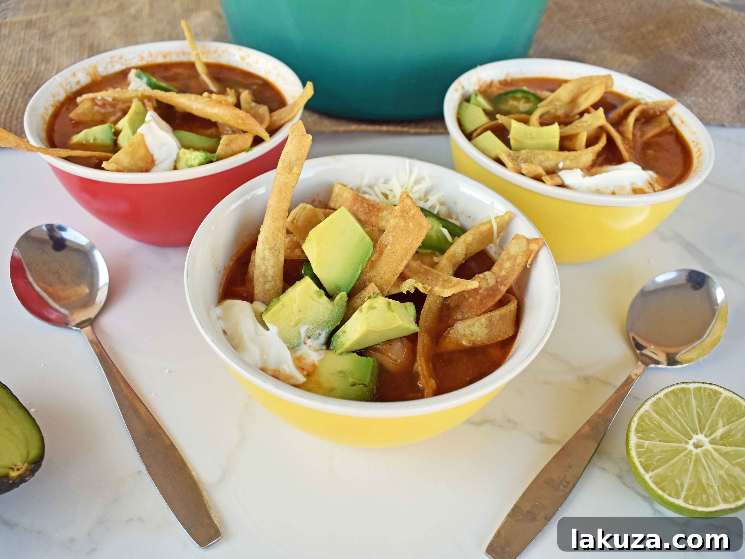 Hearty Chicken Tortilla Soup 7 A beautiful bowl of Chicken Tortilla Soup, ready to be enjoyed, adorned with all the delicious toppings for a complete meal experience.