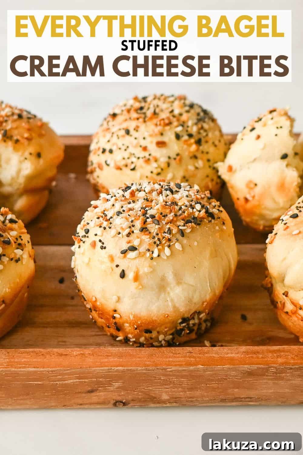 A full batch of Cream Cheese Filled Everything Bagel Bites freshly baked and cooling on a wire rack, ready to be served or stored.