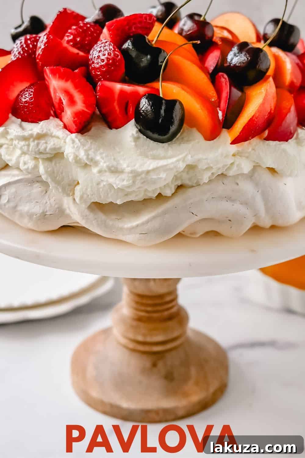 A grand Pavlova with an abundance of fresh fruit, showcasing its celebratory appeal.