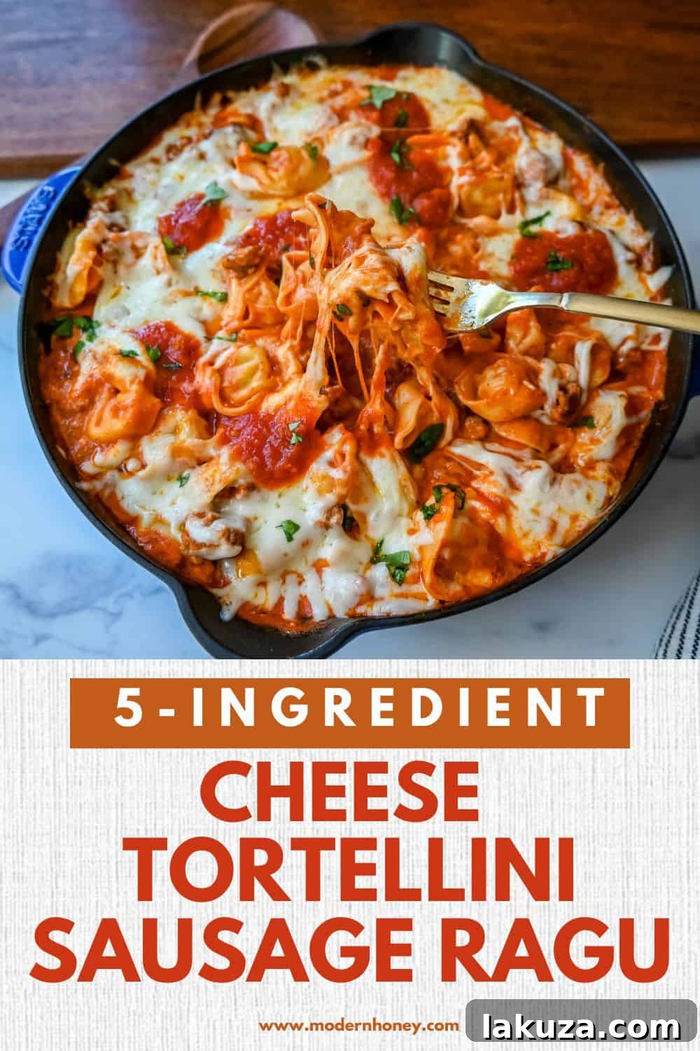 Pillowy Tortellini with Robust Sausage Ragu 7 Overhead shot of a full skillet of Cheese Tortellini with Sausage Ragu, topped with melted mozzarella and fresh basil, ready to be served.
