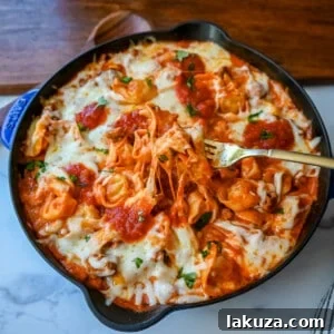 Pillowy Tortellini with Robust Sausage Ragu 8 Close-up of Cheese Tortellini with Sausage Ragu, a quick and easy 20 minute pasta bake with cheese tortellini in Italian sausage ragu sauce and melted mozzarella. A perfect 5-ingredient dinner!