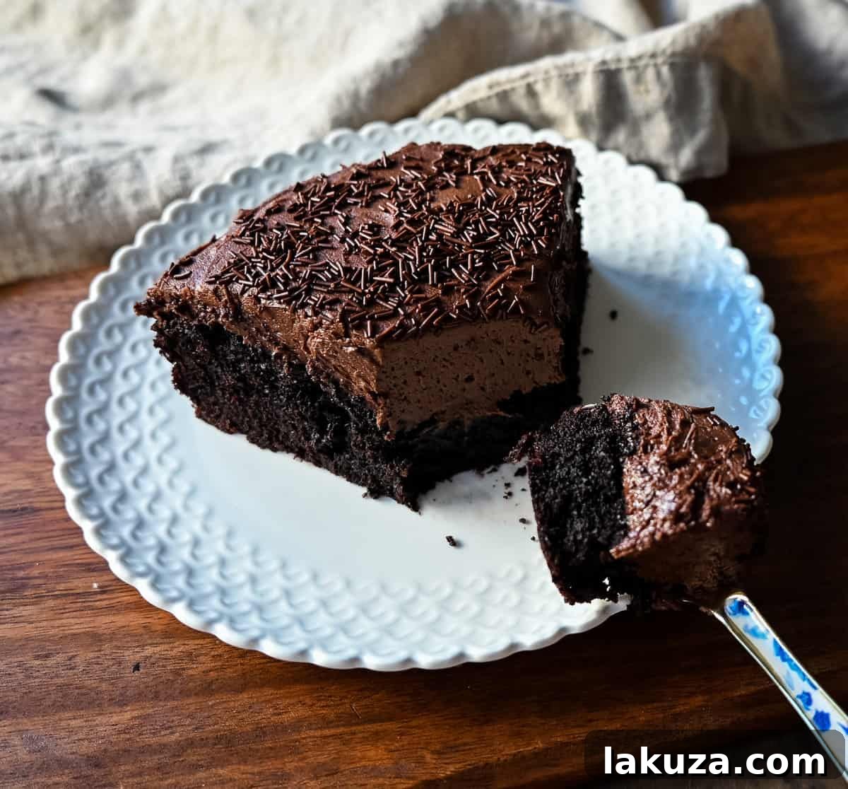 Moist, rich Chocolate Olive Oil Cake topped with smooth chocolate buttercream, ready to be enjoyed.