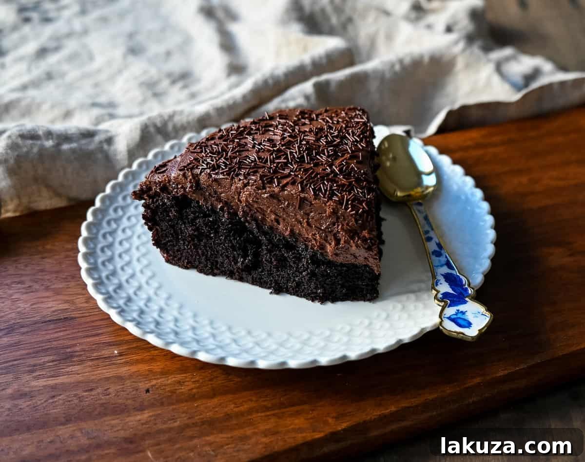 Freshly baked Chocolate Olive Oil Cake cooling on a wire rack before frosting.