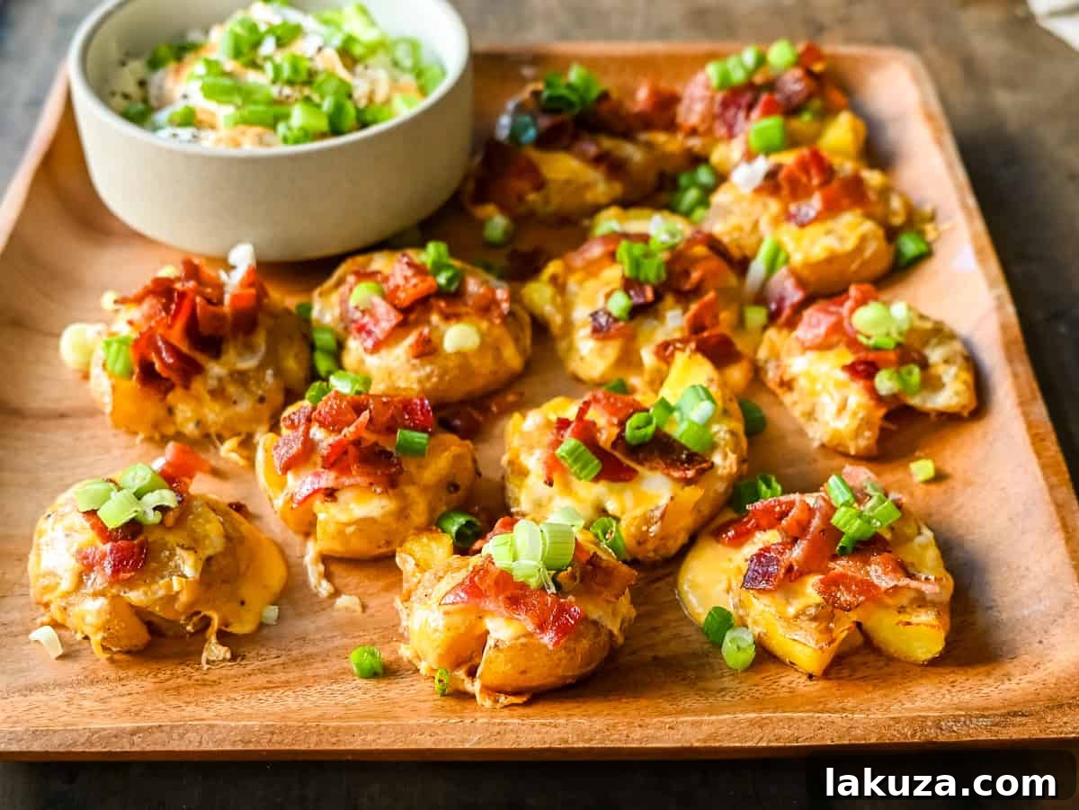 Loaded Bacon Cheddar Smashed Potatoes. Crispy and buttery smashed potatoes topped with bacon, cheddar cheese, and green onions. A perfect side dish.