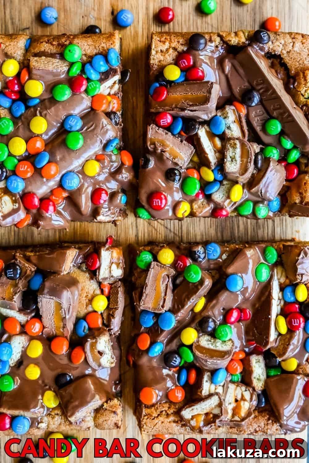 Ultimate Candy Bar Blondies 9 Candy Bar Cookie Bars. An ooey gooey cookie bar topped with an assortment of candy bars. The perfect candy bar blondie dessert to make with Halloween candy.