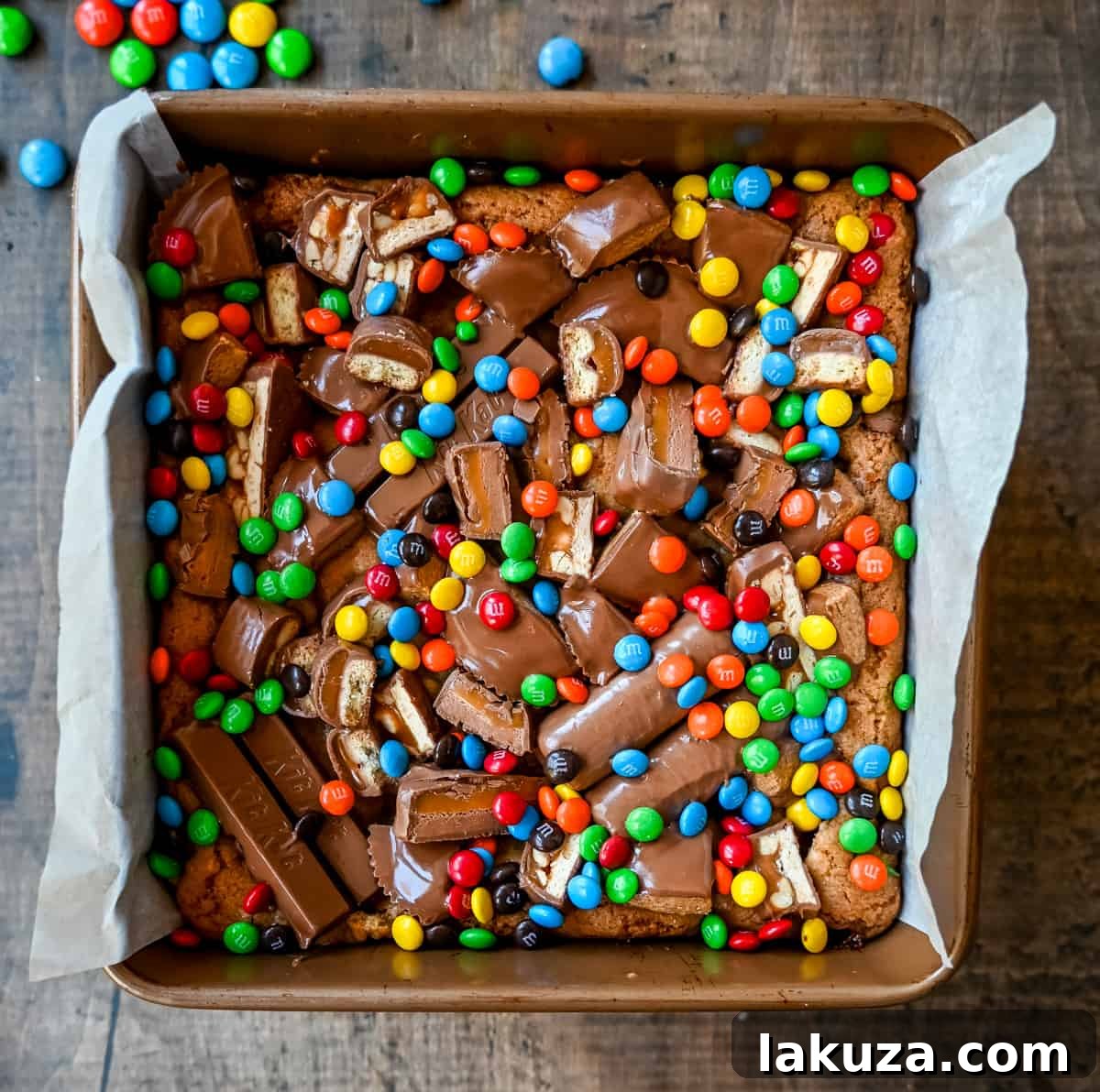 Ultimate Candy Bar Blondies 6 An ooey gooey cookie bar topped with an assortment of candy bars. The perfect candy bar blondie dessert to make with Halloween candy.