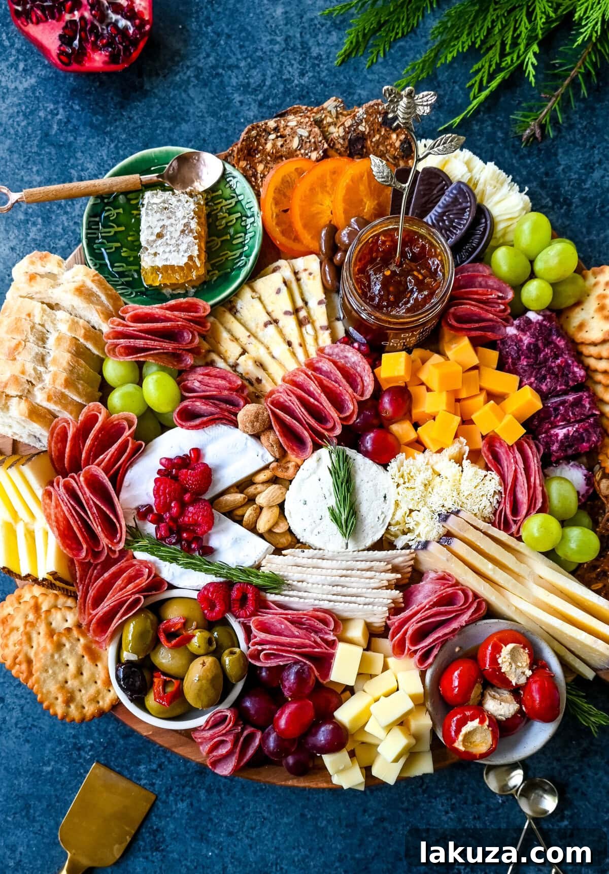 Creating a Showstopping Charcuterie Board 14 A lavish charcuterie board, packed with a diverse selection of cheeses, thinly sliced cured meats, fresh and dried fruits, nuts, olives, and crisp crackers, presented on a wooden board.