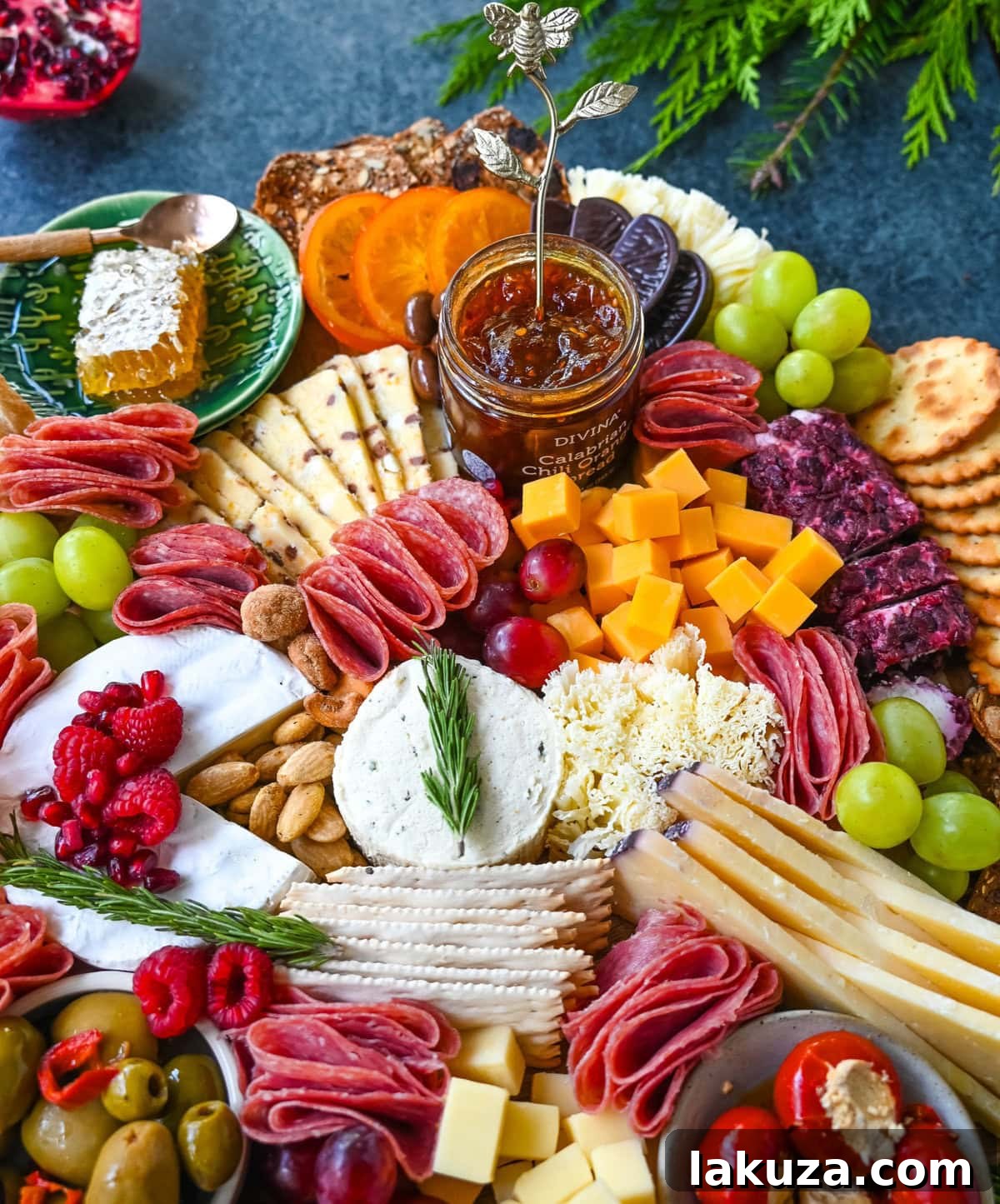 Creating a Showstopping Charcuterie Board 7 A vibrant charcuterie board, richly packed with diverse ingredients including various cheeses, cured meats, an abundance of grapes, and an assortment of fresh berries and figs.