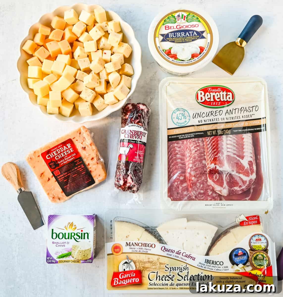 Creating a Showstopping Charcuterie Board 8 A selection of charcuterie meats and various cheeses, including a round of Brie, a block of cheddar, and sliced deli meats, ready for a gourmet board.