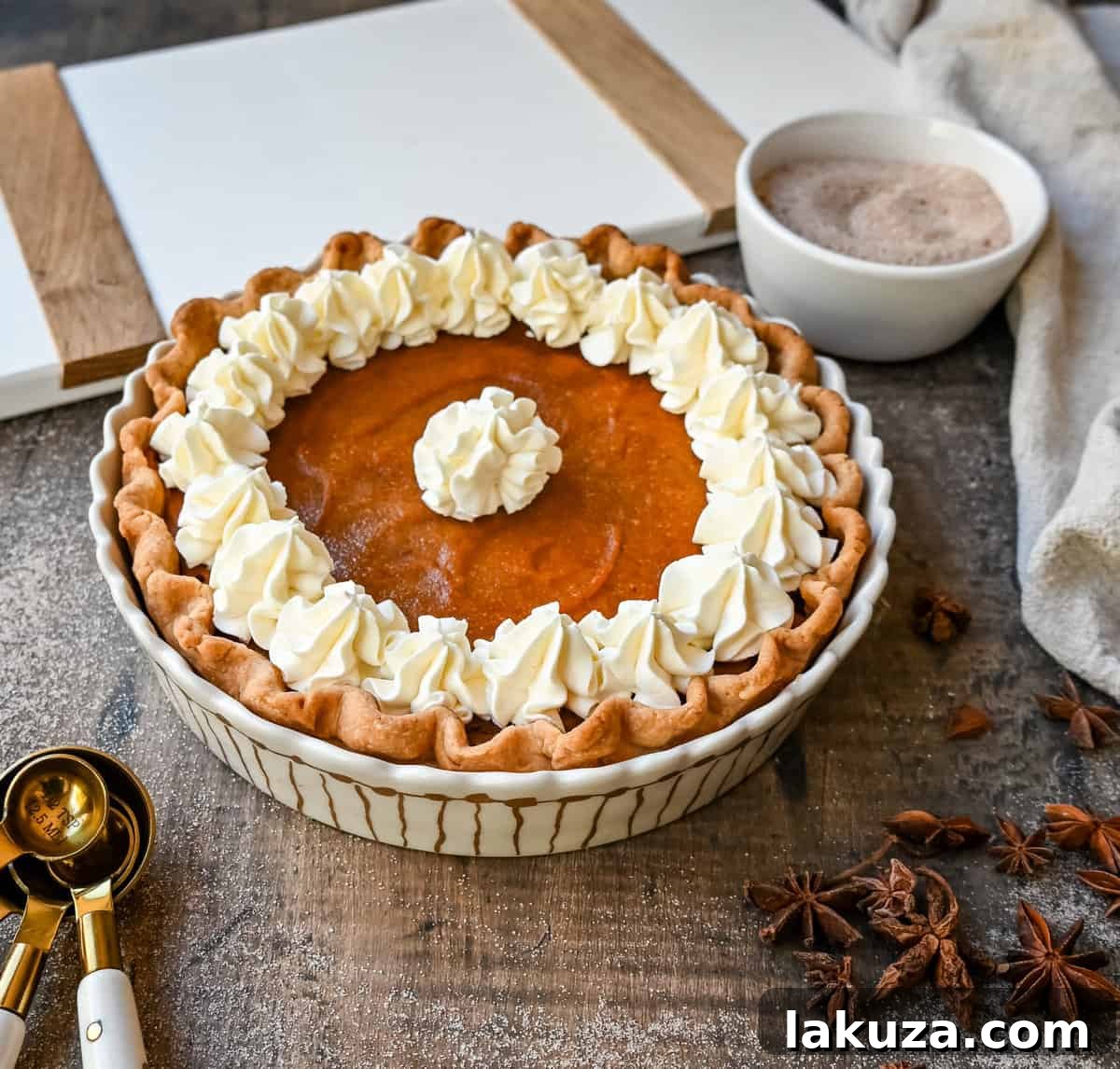 Close-up of a slice of Southern Sweet Potato Pie, showcasing its creamy texture and golden-brown crust. Ideal for holiday gatherings.