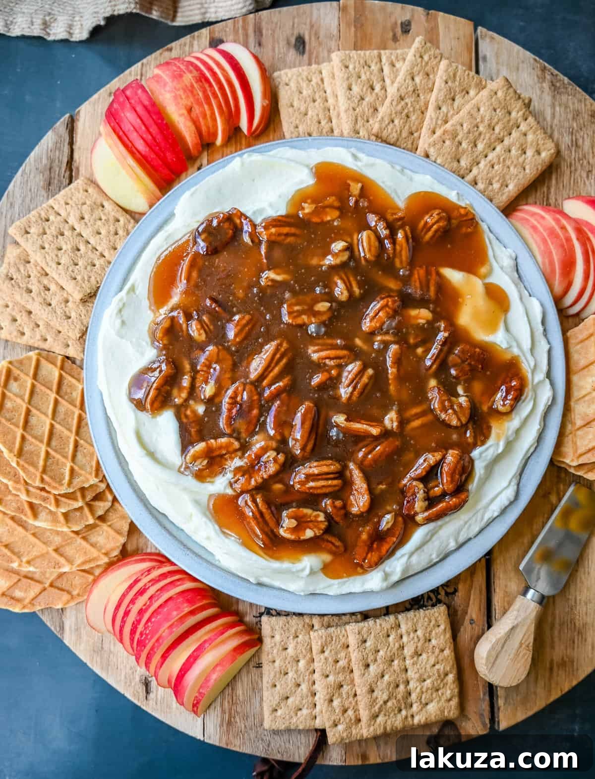 No Bake Pecan Pie Dip. This Pecan Pie Dip is made with creamy, fluffy, sweet cream cheese and whipped cream topped with a homemade pecan caramel sauce. This is all of the flavors of pecan pie without all of the work. A sweet and delicious holiday appetizer.