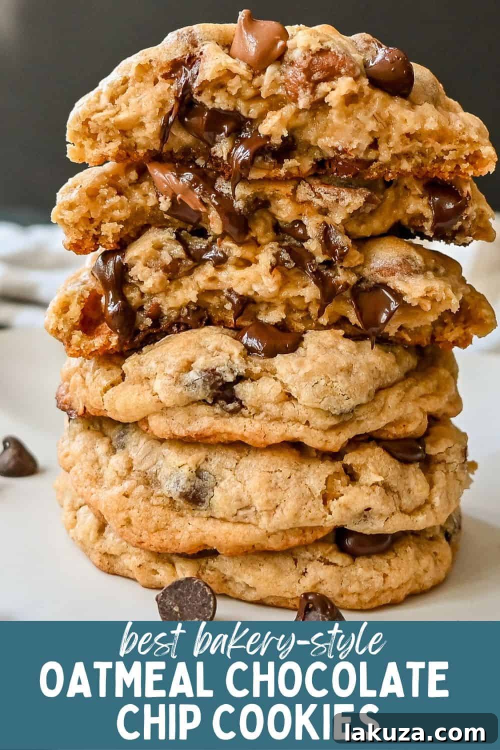 Signature Bakery Oatmeal Chocolate Chip Cookies 9 A tall stack of bakery-style oatmeal chocolate chip cookies, garnished with extra chocolate chips.