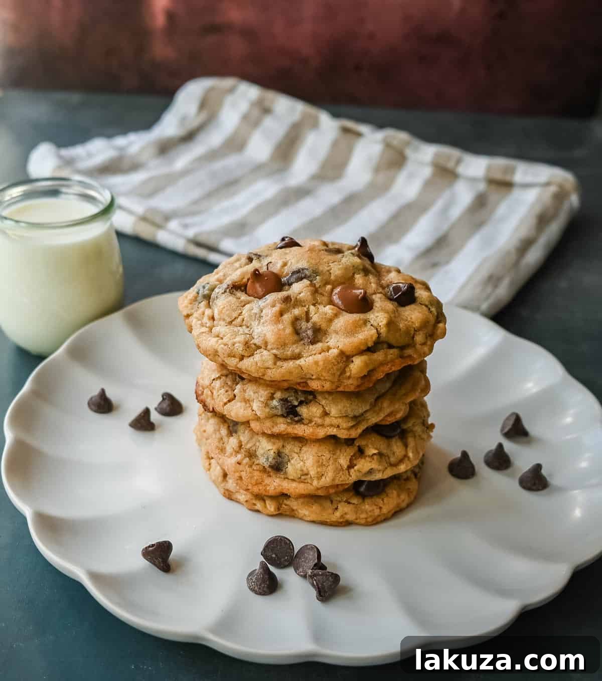 Signature Bakery Oatmeal Chocolate Chip Cookies 7 Close-up of a single bakery-style oatmeal chocolate chip cookie, highlighting its rich texture and melted chocolate.