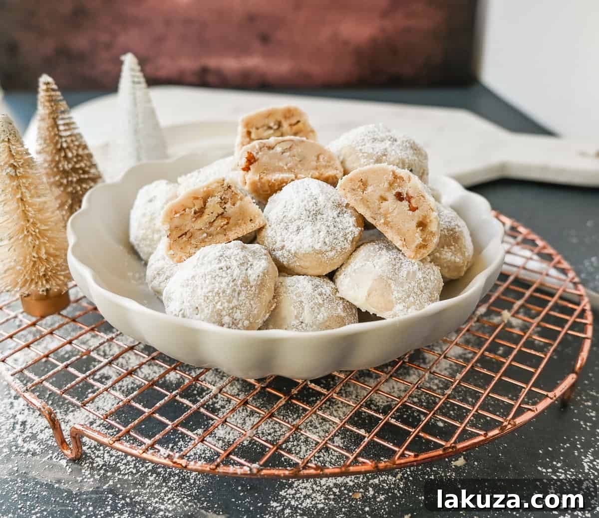 Elegant Pecan Snowball Cookies 4 Mexican Wedding Cookies (Snowball Cookies) on a baking sheet, ready for their powdered sugar coating.
