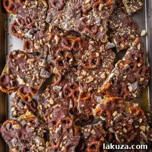 Toffee Pretzel Christmas Crack. This is Christmas Crack but even better! This homemade chocolate toffee bark is made with crunchy pretzels, soft buttery toffee, rich chocolate, and Heath bar chocolate toffee bits. This is a super easy Christmas crack recipe and perfect to share around the holidays.