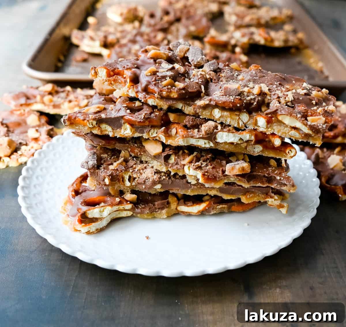 Close-up of Toffee Pretzel Christmas Crack with melted chocolate, highlighting its irresistible texture and festive appeal.