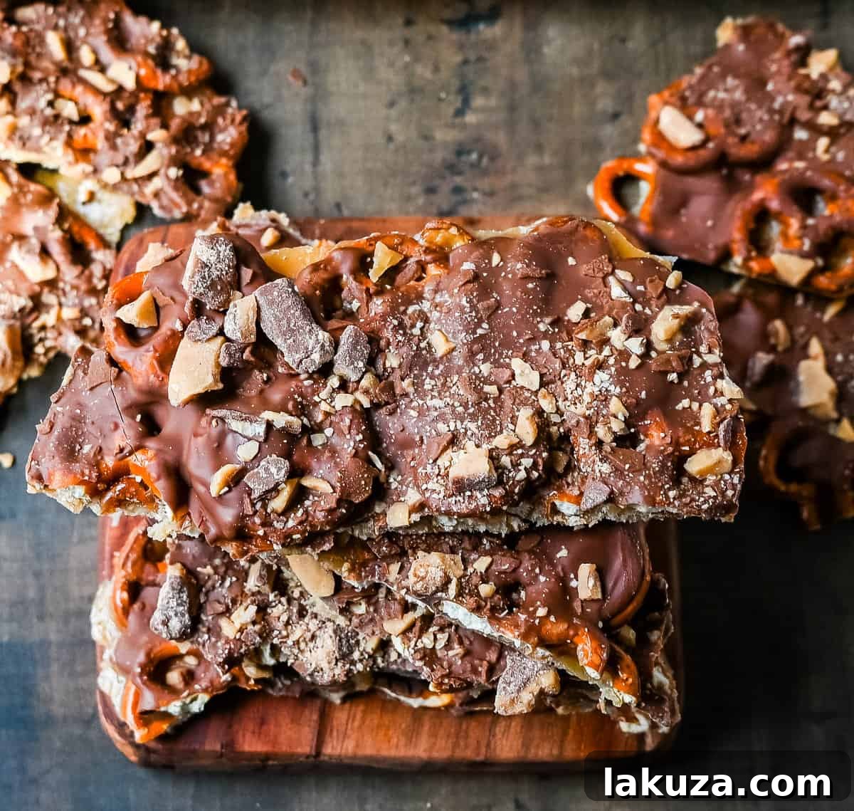 Freshly baked Toffee Pretzel Christmas Crack cooling on parchment paper, showcasing the golden toffee layer.