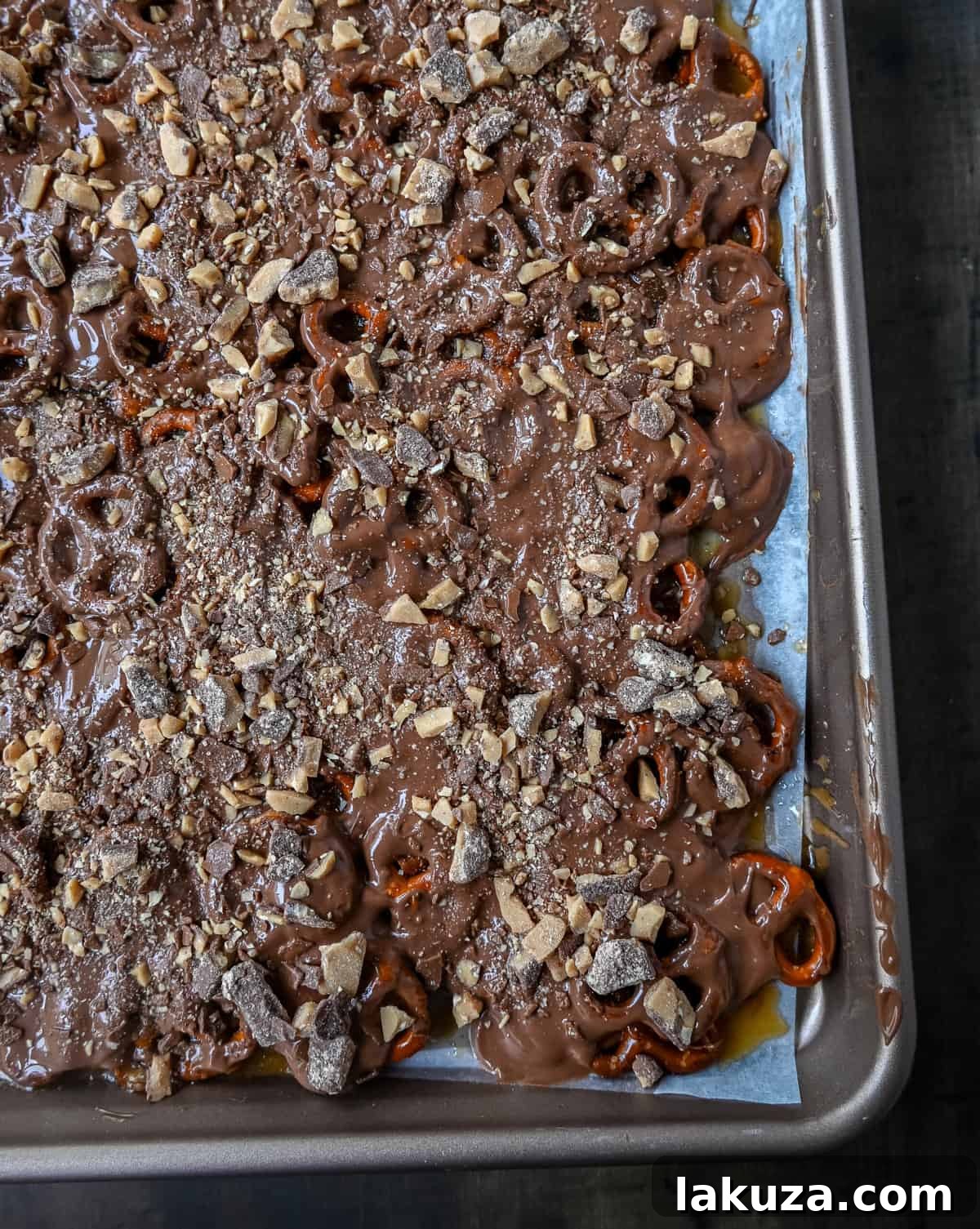 Finished Toffee Pretzel Christmas Crack generously topped with Heath bar bits, ready to be broken into pieces.
