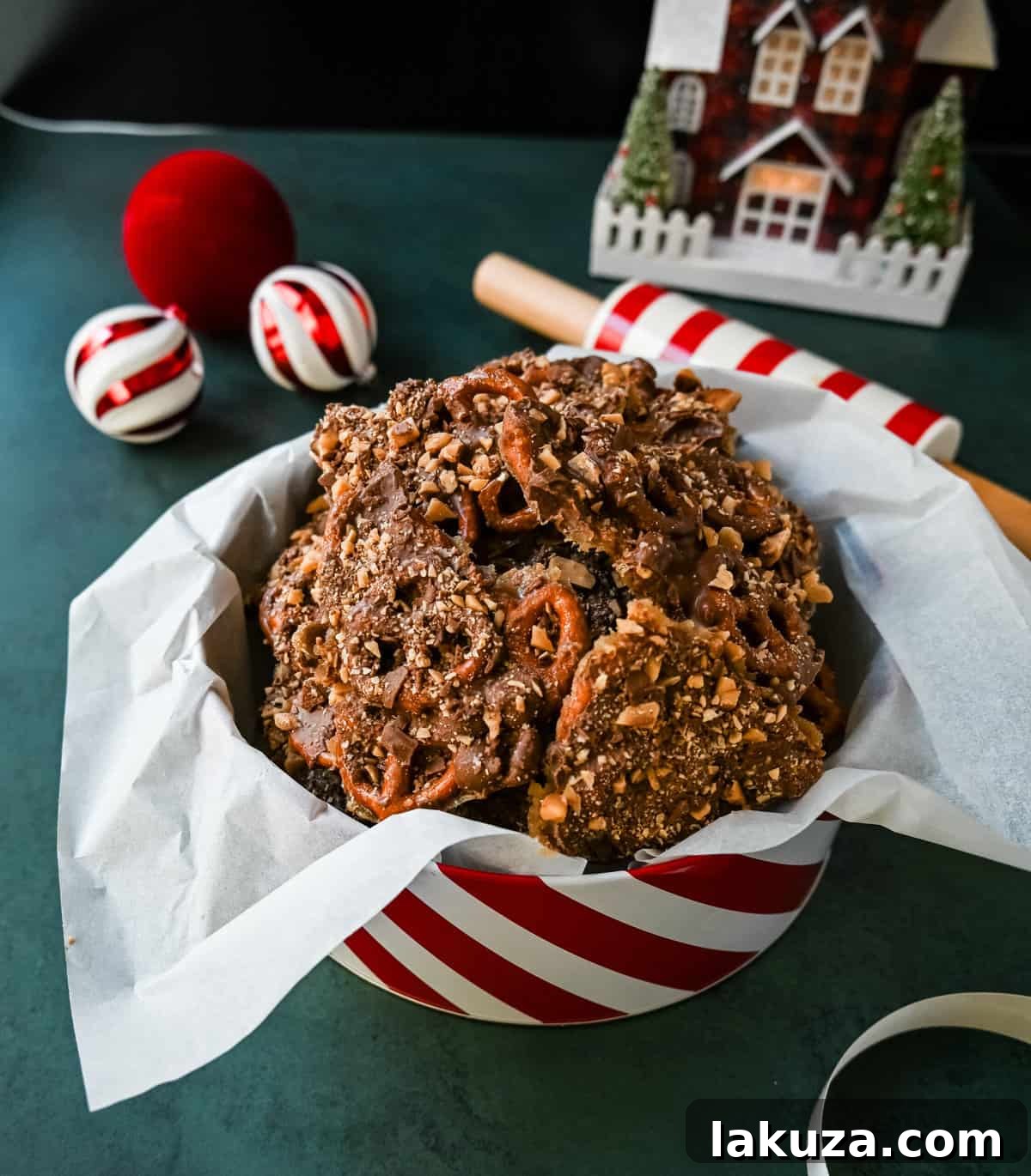 Toffee Pretzel Christmas Crack displayed in festive goodie tins and boxes, perfect for holiday gifting.