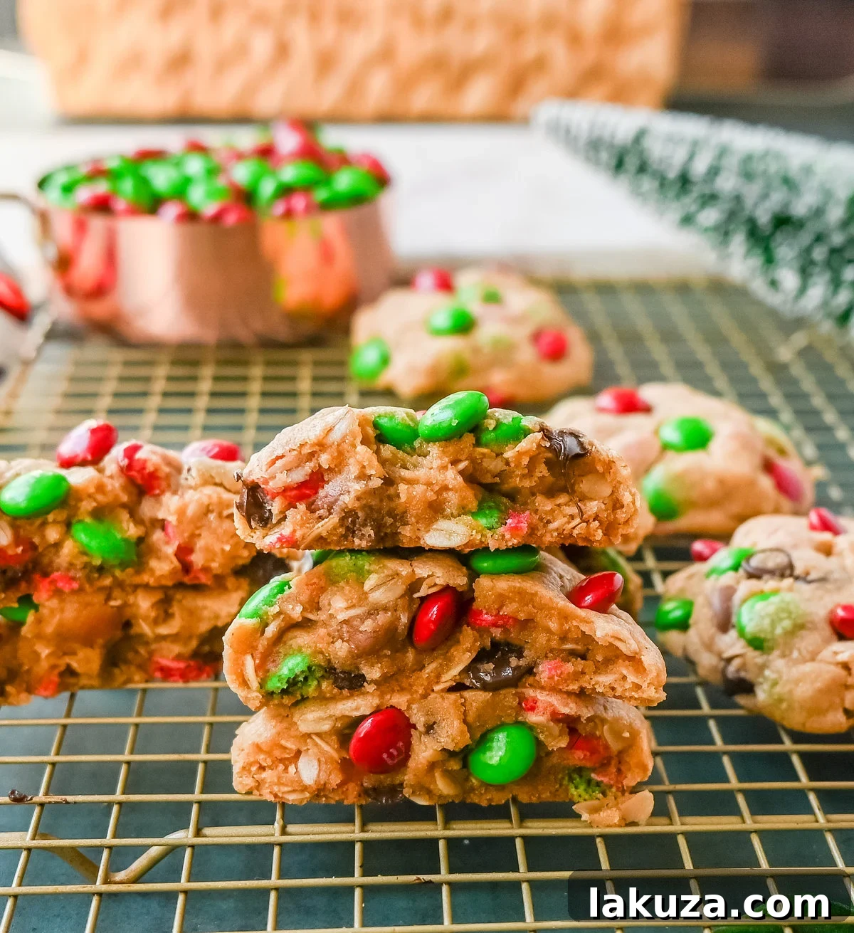 Christmas Monster Cookies: A close-up of soft, thick, and chewy cookies made with oats, peanut butter, chocolate chips, and festive red and green M&M's, ready for holiday celebrations.