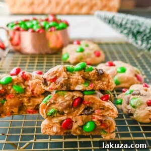 Christmas M & M Cookies. Soft, thick, and chewy Christmas Monster Cookies with oats, peanut butter, chocolate chips, and holiday M&M's, a perfect festive treat.