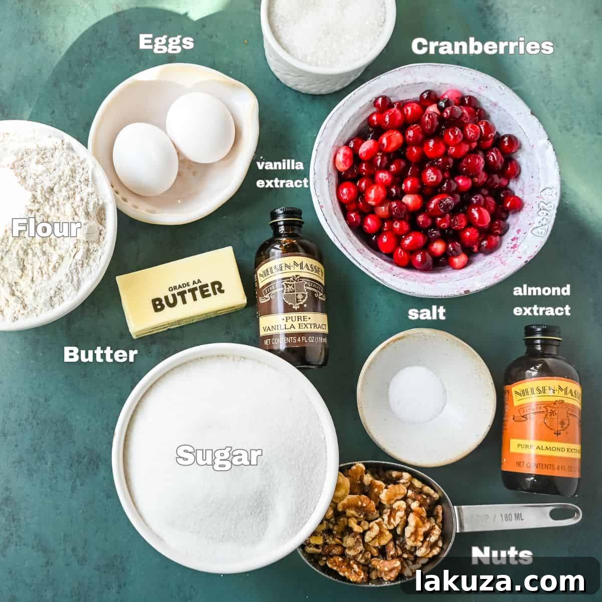 Essential ingredients for Nantucket Cranberry Pie, including fresh cranberries, butter, sugar, flour, eggs, and extracts, neatly arranged.