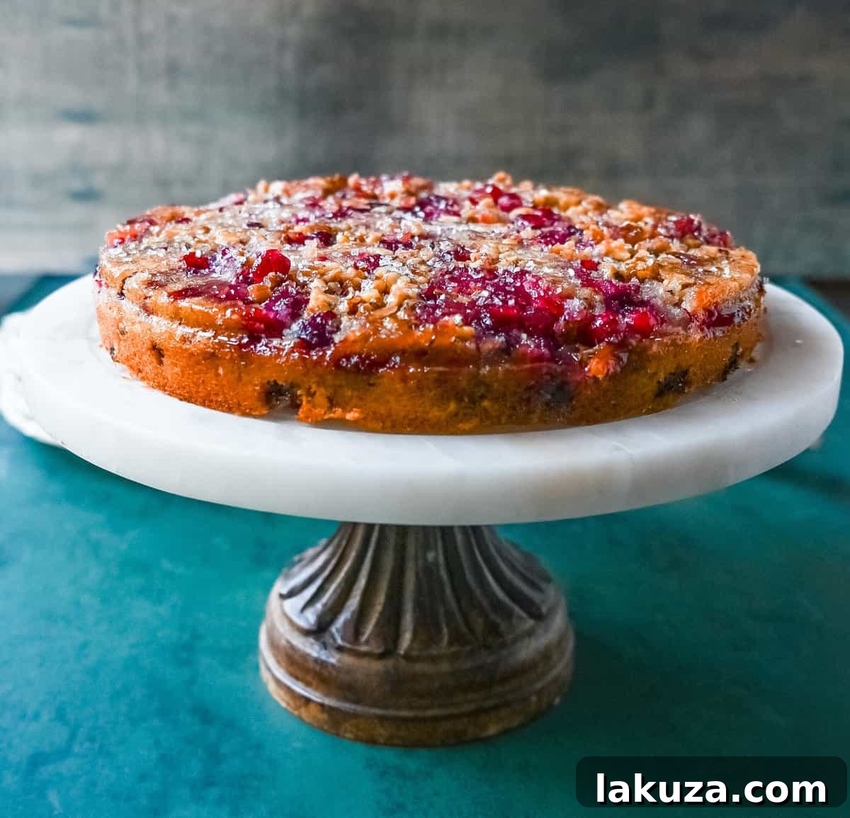 A whole Nantucket Cranberry Pie, freshly inverted to showcase its beautiful, glistening cranberry topping, ready to be sliced and served.