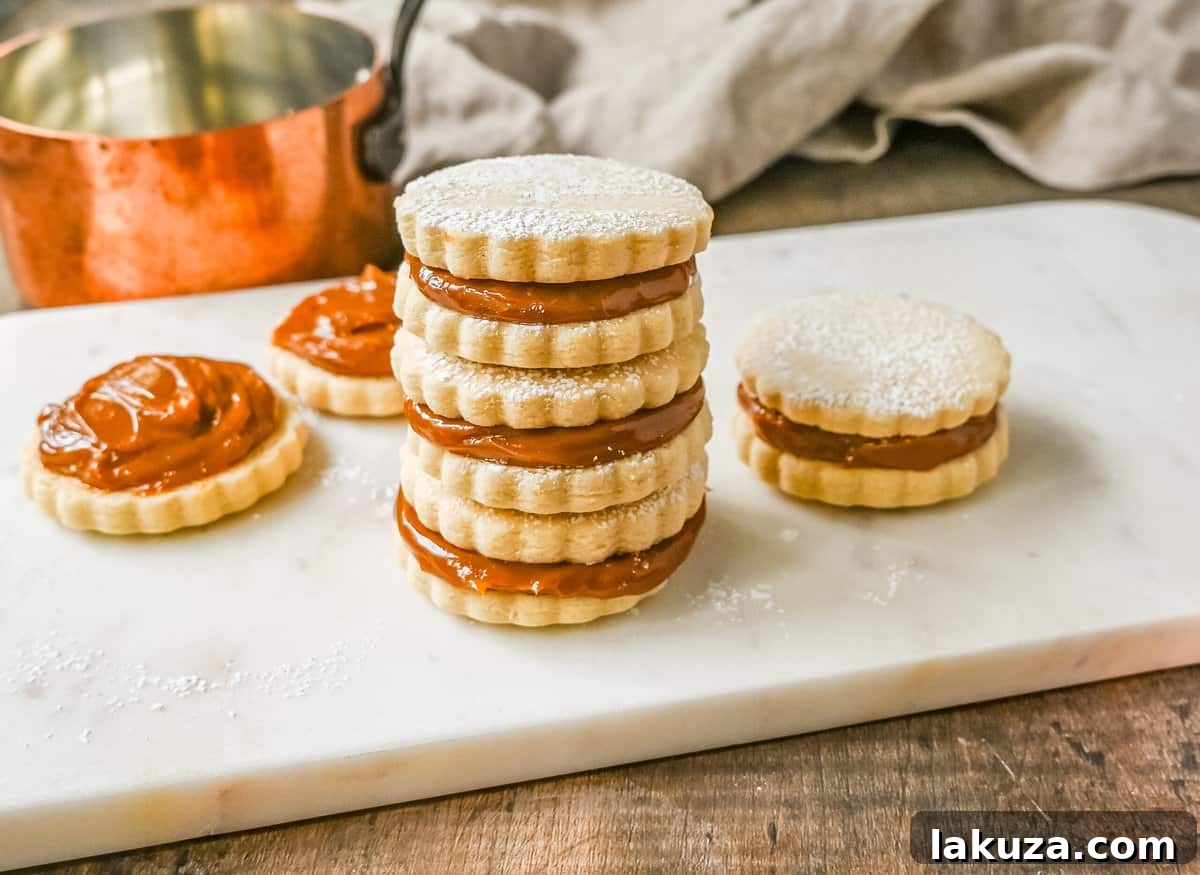 Stack of Alfajores, highlighting their delicate edges and golden color.