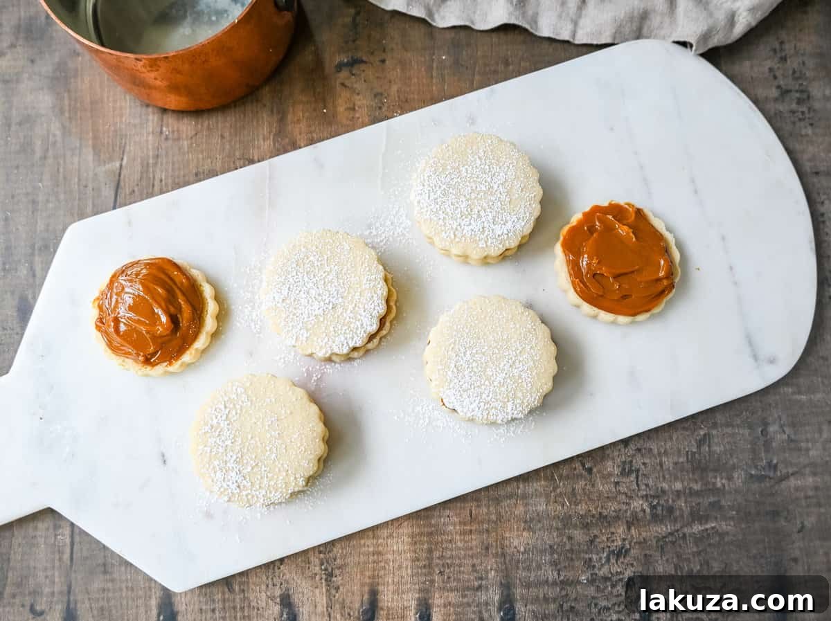 Alfajores with a thick layer of dulce de leche filling.