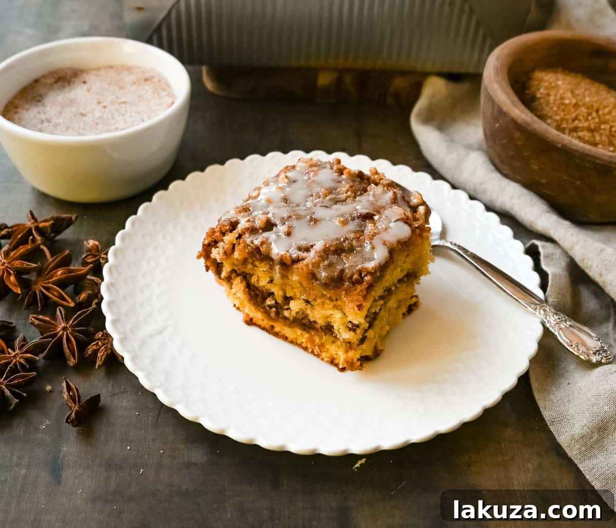 Best Coffee Cake Recipe. This cinnamon brown sugar sour cream coffee cake is made with a buttery cake layered with a brown sugar cinnamon layer and topped with a streusel topping and a sweet glaze. The best coffee cake recipe perfect for breakfast or brunch.