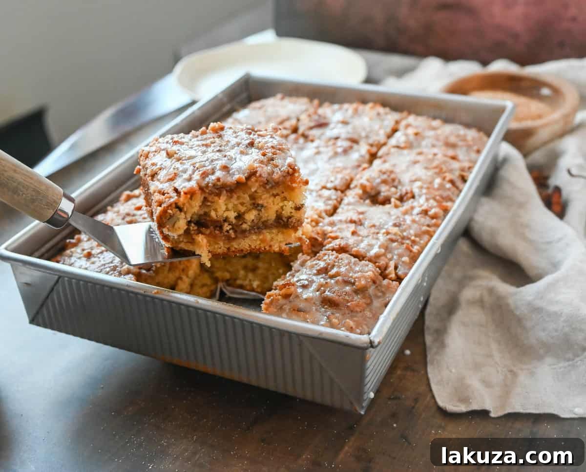 Best Coffee Cake Recipe. This cinnamon brown sugar sour cream coffee cake is made with a buttery cake layered with a brown sugar cinnamon layer and topped with a streusel topping and a sweet glaze. The best coffee cake recipe perfect for breakfast or brunch.